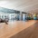 Large fitness center with large windows and plenty of equipment