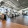 Large fitness center with large windows and plenty of equipment