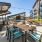 Large rooftop lounge with grilling stations and ample seating 