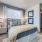 Large bedroom with wood floors 