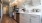 Spacious and well lit kitchen with wood flooring and stainless steel appliances